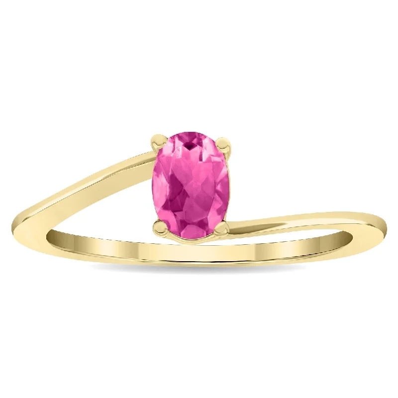 wedding rings with gemstones -Women's Solitaire Oval Shaped Pink Topaz Wave Ring in 10K Yellow Gold